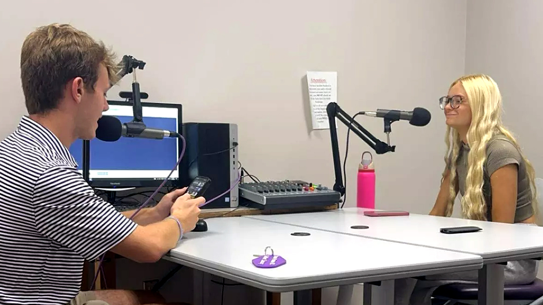 Students Brodie Riley and Kimber Boshell practice using the recording equipment as part of their podcasting class.